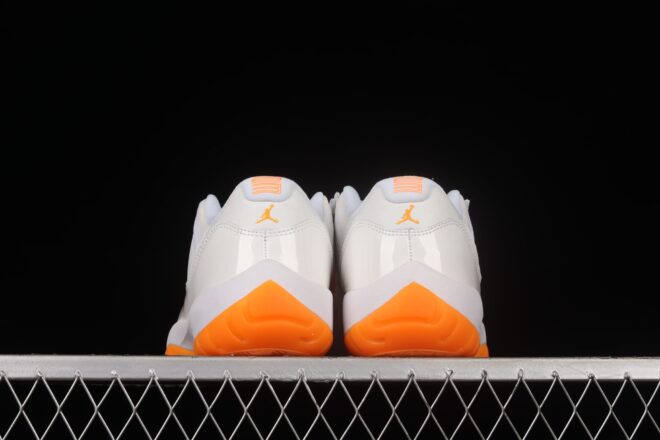 ’ featuring vibrant orange accents and a classic white leather upper.||||||||||